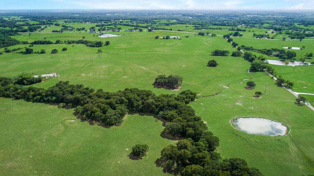 72+- Acres in the ETJ of City of Oak Grove.  Seller just obtained a new survey and also had City of Oak Grove to put in larger water line.  Seller is willing to subdivide. There is a large creek at the back of the property and flood plain.  Bring your house plans and build your dream home.  Will deed restrict at closing, sight built homes only, barndaminiums are allowed.  Easy access to 175 for commute and close to schools and shopping etc.

Buyer and Buyer's agent to verify all info.