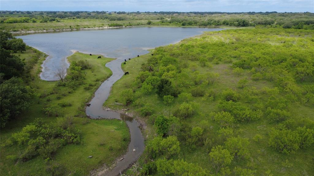 PRIVATE 15 ACRE LAKE!!!  If you’re a true sportsman, opportunities like this don’t come around often.  Spanning nearly 324 acres, this exceptional ranch offers a rare combination of recreational freedom and natural beauty. At the heart of the property lies a stunning private lake, fluctuating between 10 to 15+ acres depending on the season — a remarkable feature you simply don’t find every day.  This is a hunter’s paradise, with thriving populations of deer and turkey roaming the rolling terrain. And when hunting season pauses, the fishing doesn’t. The lake is home to impressive largemouth bass — the kind that make for stories worth telling (and yes, they’re really in there!).  The landscape is a blend of gently rolling hills and mature oak trees, creating scenic views around every turn. Whether you’re riding, hiking, or simply enjoying the quiet, each corner of the ranch reveals another picturesque vantage point.  An older hunter’s cabin sits comfortably on the property, offering a warm and dry retreat during cold mornings or rainy afternoons. A water well services the cabin, adding practical convenience to this rustic escape.  Large acreage. Private lake. Hunting. Fishing. Privacy.
How often does a property come available where you can launch a small boat, spend the day fishing your own water, and never leave your land?  
This is more than acreage — it’s a rare recreational legacy property waiting for its next owner.  Come experience this truly remarkable opportunity for yourself.