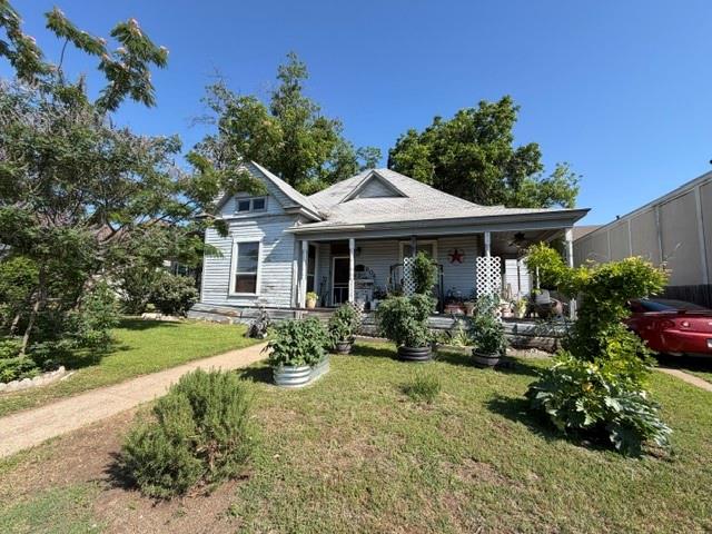 Step into the charm of this early American home just minutes from downtown Cleburne. Full of timeless character, this property offers the perfect blend of vintage appeal and everyday convenience. A large covered front porch welcomes you inside, where you’ll find original hardwood floors, high ceilings, beautiful built-ins, and abundant natural light throughout. The home’s classic charm continues in one of the bathrooms with an original clawfoot tub that adds a touch of nostalgia and style. Situated on a spacious lot, the backyard features a large deck ideal for relaxing, entertaining, or enjoying quiet evenings outdoors. Recent improvements include new windows, updated electrical, and updated plumbing. Located within walking distance to local shops, dining, and H-E-B, this home offers small-town charm with unbeatable convenience. There is no central air or heat. Great opportunity for investors or buyers looking for a project, this fixer-upper offers plenty of potential to renovate, customize, and add value.