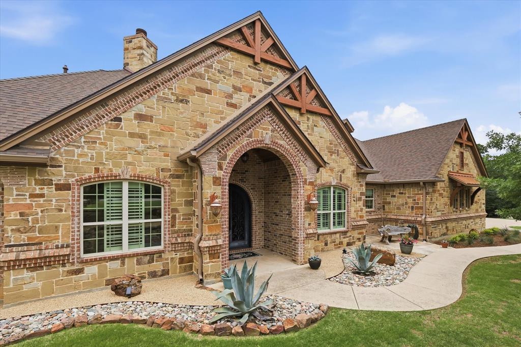 A Victor Meyers custom home comprised of 3297 sq ft in the main house and 1277 sq ft in the apartment. This absolutely stunning 4-bed, 4-full-bath, 2-half-bath, 6-car, oversized, epoxied garage, and a massive staircase to a fully decked-out attic, with this custom luxury estate, is beautiful & immaculate, has an open-concept, and sits on a private, just under 4-acre, treed lot. This amazing home is adorned with gorgeous, hand-scraped hardwood floors, soaring ceilings, crown molding, all-neutral colors, 3 WBFPs, tons of natural light, magnificent built-in features, 2 full laundry rooms, incredible outdoor living space, and so much more! The massive, chef's dream kitchen features custom 42-inch handmade Chandler cabinets, exquisite granite countertops with a stone backsplash, a huge island, Thermador appliances throughout, and a built-in fridge, all while overlooking the huge living room, breakfast area & fabulous covered back patios & yard. The wonderful primary bedroom & bath offer a spacious walk-in closet, a jetted tub, a large, fully tiled walk-in shower & dual vanities. The terrific office-library, with lovely wood-built-in storage, is perfect for the work-from-home professional. Enjoy movie nights or ballgames in the spacious media-game room featuring a huge, 100-inch projector screen & surround sound spkrs. The MIL apartment offers a full kitchen, its own laundry room, a bedroom, a full bath & a half bath, an office, a large living area with wbfp, as well as its own separate entrance & private patio! Relax, grill, or entertain on the immense 23x22 back patio, perfect for big gatherings, or just sit & enjoy the peace, quiet & scenery! The lot is professionally landscaped. A 116K, a 50-year roof replacement was completed in 2024. It is also built on a 98-pier foundation for durability.  Owners pay no City of Aubrey taxes. Enjoy a country feel only minutes from downtown Denton & the N Dallas Tollway. Tons of attic storage! It's a rare find indeed!