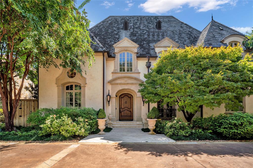 Refined Country French Estate crafted by Luxury builder Bob Thompson & renowned architect Robbie Fusch. Enjoy expansive living spaces created w the finest materials, craftsmanship & impeccable attention to detail: rich paneled library, dining room w gold leaf dome ceiling, great room featuring full mortise & tenon trusses, & elevator. The gourmet kitchen features top-of-the-line appliances, custom cabinetry, w expansive counter space perfect for both intimate gatherings & grand entertaining. Retreat to the 1st level primary suite, w living space & two ensuite bathrooms. The basement offers another private entertaining space w antique brick walls & wine cellar.  Secluded guest suite on the 1st level. 2nd level offers 4 bedrooms, game room, & multiple flex rooms. Outdoor living is a haven for relaxation & entertainment with an expansive outdoor loggia, & custom pool with fountain & spa. Beautifully manicured landscape by Robert Bellamy Designs.