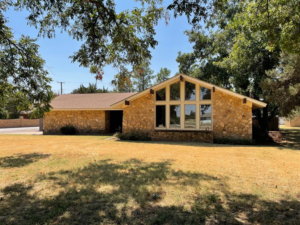 Beautiful rock and brick home in the Arledge Addition.  This 3 bedroom, 2 bath home is perfect for a growing family.  It has an open living room with large windows and cathedral ceilings, a den with a fireplace, kitchen with a breakfast area and spacious bedrooms.  The back yard is privacy fenced with a covered patio and storm cellar.  Homes like this one don't come on the market very often.  Come take a look today.