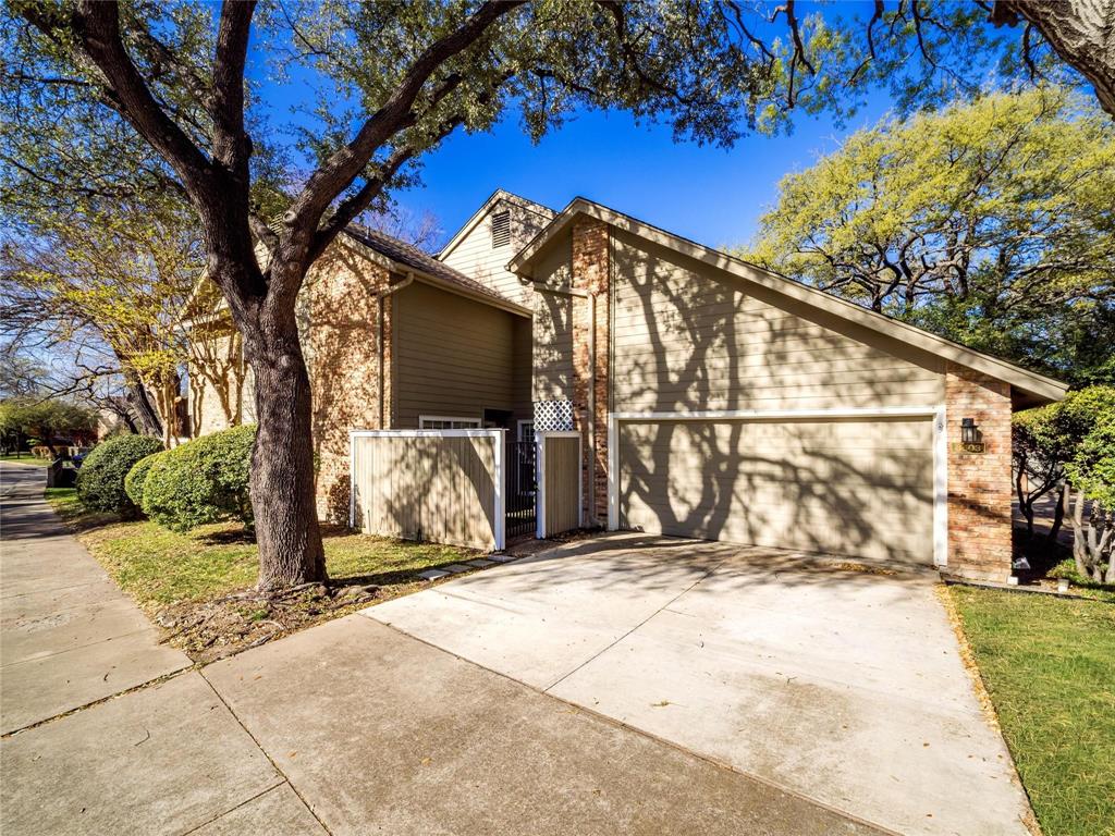 Offering a FREE 1 Year temporary 1% rate buy down through preferred lender. Located in the heart of Lake Highlands, this updated 3 Bed, 3 Bath home offers the ideal combination of privacy, functionality, and convenience in one of Dallas’ most established and sought-after areas. Backing to a peaceful greenspace filled with mature trees, the oversized private patio and deck create an outdoor setting that feels tucked away while still being minutes from everything. Inside, the open floorplan is filled with natural light and features vaulted ceilings, a spacious living area with a fireplace, and a custom built-in cabinet and wet bar designed for entertaining. The layout flows effortlessly between the living, dining, and kitchen spaces, making the home feel both comfortable and functional for everyday living. One of the secondary bedrooms features extensive built-in shelving and abundant natural light, creating the perfect flex space for a home office, study, or creative workspace. Ample storage throughout the home adds to the practicality rarely found at this size and price point. Upstairs the primary suite overlooks the greenbelt & creek and the other bedroom offers a large soaking tub. The primary suite offers tons of natural light, large bathroom, and walk in closet. Positioned within highly rated Lake Highlands ISD and seconds from Lake Highlands Town Center, quick access to shopping, dining, entertainment, and everyday conveniences including Sprouts Farmers Market, Mi Cocina, and numerous new developments in the area. With major highways nearby, commuting anywhere in Dallas is simple. This is an opportunity to own a low-maintenance home with outdoor privacy, strong location appeal, and a highly functional layout in Lake Highlands. The HOA takes care of landscaping, roof maintenance, and exterior insurance, providing a truly low-maintenance lifestyle.