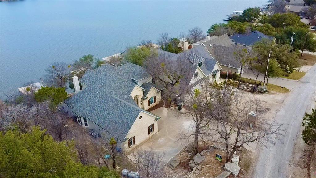 Gorgeous main-body waterfront home on Lake Granbury offering stunning lake views and extensive updates. This 4-bedroom, 2.5-bath residence provides spacious living and excellent indoor-outdoor flow for enjoying lake life year-round. Recent improvements include a newly installed roof, updated flooring, fresh interior paint, and a new deck overlooking the water. The kitchen is a dream. Perfect for entertaining complete with granite counters, stainless appliances and a gas stove. The primary suite features a claw-foot tub, tile backsplash, and barn door accents. Located on the main body of Lake Granbury, this home offers prime waterfront access and move-in ready condition. 
SELLER IS OFFERING 5K IN CLOSING COST! HIGHLY MOTIVATED