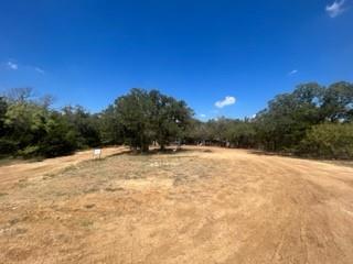 Tucked away in the quaint and quiet community of Keene, this 7 acre property would make the perfect spot to build your new home! This land is currently in Keene ETJ with city water, electric available.  The mobile home on the property will need to be removed.  Please DO NOT enter the mobile home for safety reasons.  Conveniently located less than 30 minutes any direction from major shopping, medical and entertainment, it also offers close access to I-35. Buyer and Buyer's agent will need to verify all utilities and zoning restrictions.