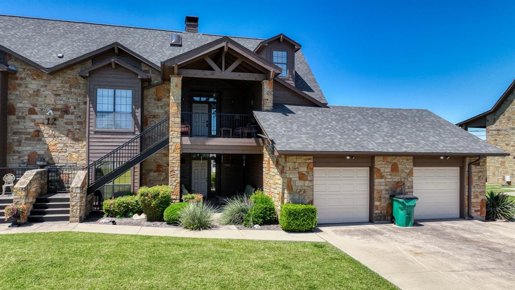 Very nice downstairs two bedroom unit. Single Car Garage. Just off the #11 Tee Box on the Golf Course. Open concept unit with living dining and kitchen. Fireplace in the living area. Open the windows and enjoy the scenic views of the golf course and rolling hillside. Make fun of me when you see me teeing off on hole #11. Tastefully decorated for the perfect lake condo. Enjoy all of The Cliffs amenities. Restaurant, Spa, pool, Marina, Beach Area, Private Roads. This is a wonderful golfing community. The Cliffs marina is one of the finest marinas on the lake. Easy slope launch ramp. Kitchen over looks the dining and living areas and can see through the windows out to the golf course. Very nice covered course side patio. Enjoy the daily breeze. Wonderful area for eating outside.