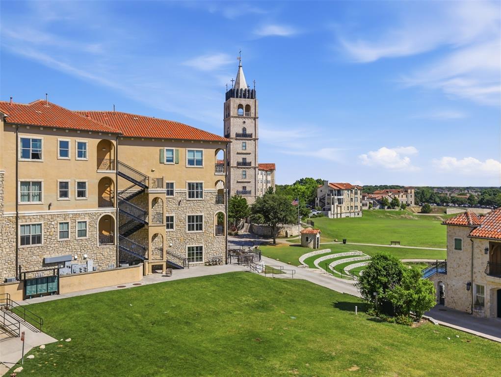 A luxury condominium for sale, in Adriatica, the European inspired McKinney community, with amazing views of the lake and surrounding area, from the balcony, living area, 2nd bedroom and master bedroom. This 2 bedroom, 2 bathroom has crown molding throughout, travertine, wood flooring and carpeted bedroom flooring. The kitchen has exotic granite countertops, a SubZero built in refrigerator, Dacor appliances, double ovens, induction cooktop and pantry.  The living room has a balcony, with views of the lake and surrounding area. The master suite has dual vanities, an oversize walk in shower, jetted tub and ample closet space. Plantation Shutters and ceiling fans throughout. This property has 2 dedicated parking spots, just outside the secure access door to the condominium. There is also dedicated basement storage. There are several shops and restaurants, within walking distance, along with scenic walking trails.