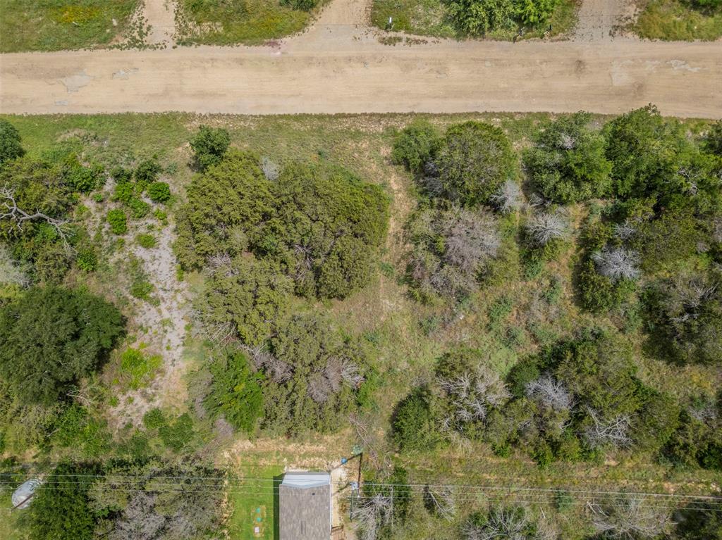 Fabulously Spacious Vacant Lot in Sought-After Community! Picturesquely located in Lake Granbury Harbor, this residential lot may easily accommodate either a single-family home or a manufactured home. Surrounded by the glistening waters of the lake, the community affords a leisurely and serene lifestyle. Whether you are seeking to build a brand-new craftsman home or enjoy a stylish manufactured home, the vacant lot is sure to please with seemingly unlimited outdoor possibilities. Add to the resale value with a gorgeous new deck, new spa, luminous sunroom, or a custom pergola. Check out Granbury’s recreational activities, and discover a plethora of possibilities, such as a skatepark, golf courses, multiple parks, trails, boating, a bark park, and fishing. Residents also bask in the variety of the nearby shopping, entertainment, and restaurants. If you are seeking investment opportunities, you are sure to be equally as pleased with your options. Private seller fin. is available with large down payment for deserving borrowers.