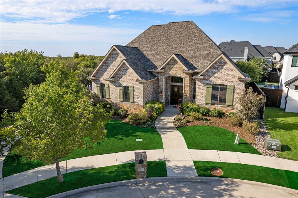 Welcome to your private vacation getaway where Texas Hill Country meets modern luxury in the gated community of Shaddock Creek Estates. This stunning architectural masterpiece in W Frisco is located on a private half-acre cul-de-sac lot, nestled alongside & seamlessly integrating with the natural beauty of Cottonwood Creek. An entertainers dream with a chef-inspired kitchen, custom cabinetry, top-tier Thermador appliances, spacious living room with custom 10'x15' multi-pocket sliding glass door completely opening to a fully insulated 4-season patio with full kitchen, gas fp & 2 12' full-view insulated glass overhead doors. Unbelievable views of the 2019 Region 3 Design Award Winning pool, featured on HGTV's Best Pools Ever, comprised of 2 separate pools connected by a spillway, 2 waterfalls, oversized spa, gas fire bowl, & heater+chiller for year-round enjoyment. 5 spacious beds, 6 full baths + study, media & game room. This home is a one-of-a-kind masterpiece you must see to believe!