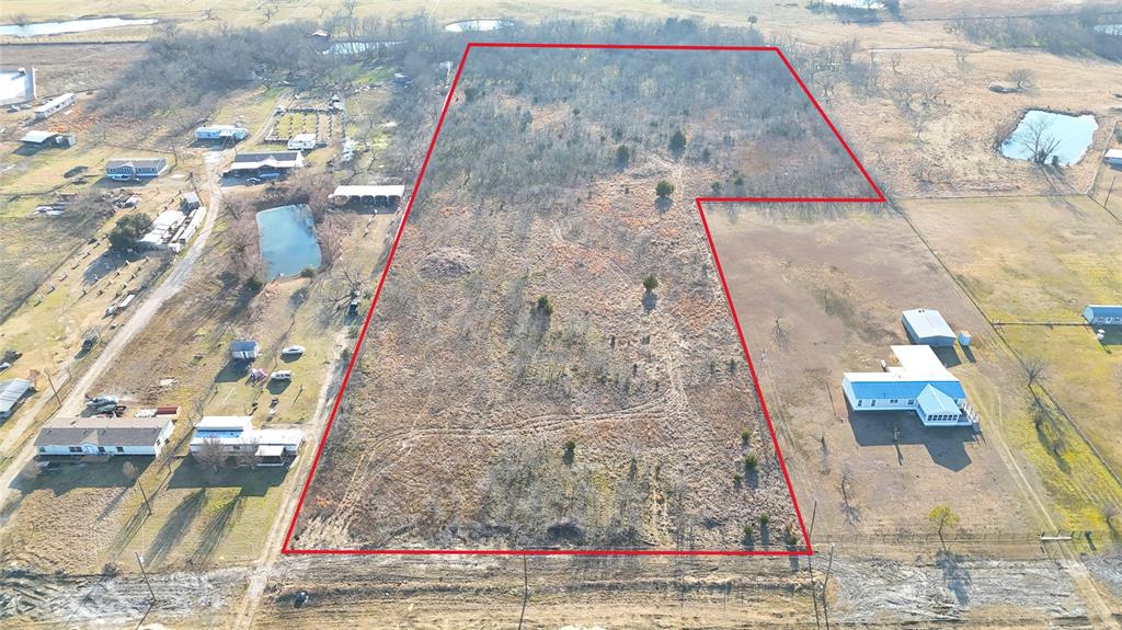 Over 11 acres of vacant land offering exceptional development potential in a high-visibility location along SH 205. With approximately 300 feet of highway frontage, this property is ideally positioned in a rapidly growing corridor surrounded by established and expanding businesses. Recently annexed into the City of Terrell, the property benefits from planned roadway improvements along SH-205, TxDOT has already acquired additional land to support future expansion enhancing long-term accessibility, traffic flow, and visibility. Conveniently located just a short drive from Rockwall and Dallas, this location offers both strong exposure and commuter accessibility, making it well-suited for a variety of potential uses including commercial, mixed-use, or light industrial development. The property is located within the City of Terrell and will require zoning verification or approval depending on intended use. Use caution when walking the property. Natural conditions such as uneven terrain, holes, and tree roots may be present. Buyer and buyer's agent are responsible for verifying all information including acreage, TxDot EXPANSION, permissible uses, etc.