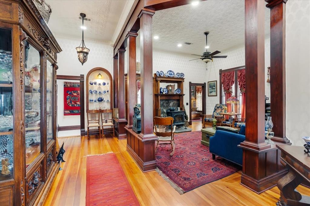 Step into timeless elegance with this impeccably maintained 1880s Victorian, where historic charm meets thoughtful upgrades. This single-story, 2-bedroom, 2-bath home showcases extraordinary craftsmanship throughout, including custom floor-to-ceiling upholstered walls, beautiful original wood columns, and all new floor and ceiling crown molding carefully selected to preserve the home’s Victorian integrity.
The custom kitchen is both stunning and functional, featuring a built-in refrigerator, custom cabinetry, and poured glass cabinet inserts that add character and light. The primary bedroom is a true retreat with a spacious cedar-lined walk-in closet.
Outside, the property is just as impressive. The lush yard includes a greenhouse and a fully integrated sprinkler system that services both in-ground landscaping and potted and hanging plants, making it a gardener’s dream.
Car enthusiasts and hobbyists will love the oversized garage, complete with a full workshop, space for multiple vehicles, and an additional two-car carport. Rich in history, meticulously cared for, and filled with rare custom details, this exceptional Victorian is truly a must-see home that offers beauty, function, and character at every turn. To top all this off, the seller will be leaving all lawn equipment, as well as appliances including the washer and dryer.