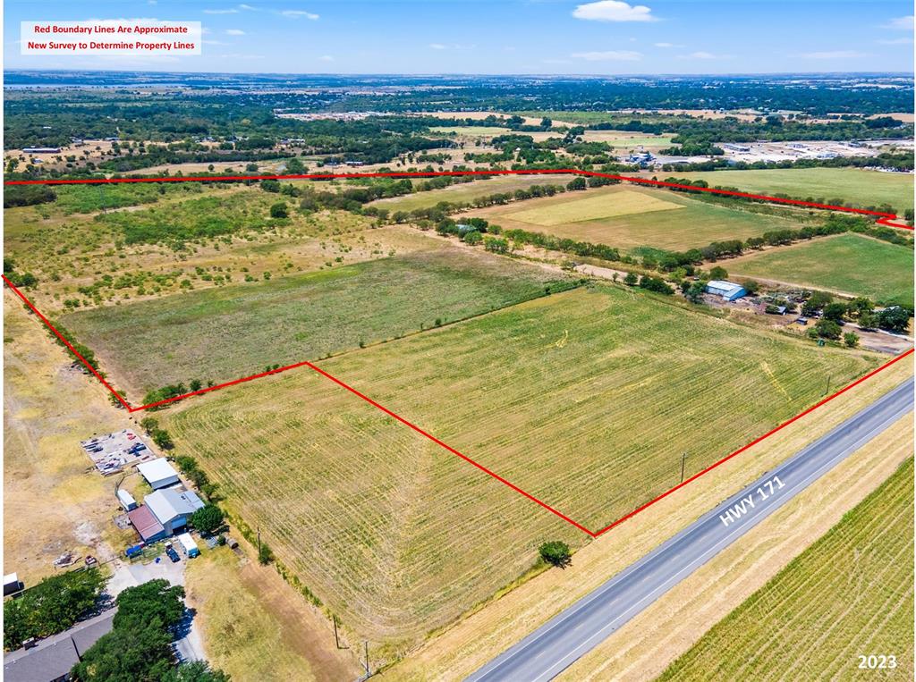 Over 90 acres of unrestricted property on Highway 171 just outside Cleburne City Limits. Located in Johnson County ETJ. This is a rare opportunity to bring your vision and development plans to life. With almost 1600 feet of road frontage and cleared property with no flood plain, this is ideal for development needs. Close proximity to downtown Cleburne. Cleburne ISD Schools. 1,745 sq ft older home with coop utilities on the property with some barns and fencing. Currently ag exempt. Johnson County Tax Ids 126.0244.02001, 126.0244.02690, 126.0244.02691.