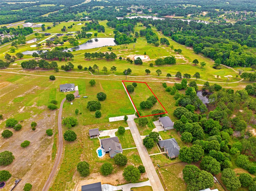 LAST LOT AVAILABLE — NO HOA! This beautiful .999-acre lot sits right on the 8th hole of the Garden Valley Golf Course inside the Hole 8 Addition at Pinehurst, offering golf-course living outside city limits and without the hassle of an HOA. The course is currently closed due to an ownership transition, but once reopened, you'll have access to future golf and country-club amenities. A cart path runs along the side of the lot, providing convenient access straight onto the course. Located in A-rated Lindale ISD, this property offers Ozarka natural spring-fed water via well, minimal restrictions (no mobile homes), and is just minutes from I-20 and downtown Lindale’s dining and shopping. Build your dream home and enjoy East Texas views and golf-course living!