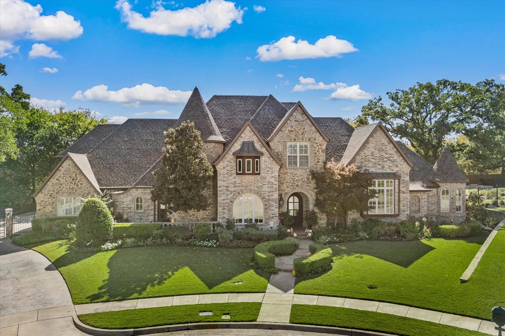 Discover unparalleled luxury in this custom-built home, nestled on an oversized treed lot within the prestigious Palomar Estates. Impeccably maintained & thoughtfully updated, this home is a perfect blend of timeless elegance & modern convenience, offering an exquisite lifestyle in one of the most sought-after neighborhoods.
As you step inside, you'll be welcomed by a stunning open layout, with attention to detail apparent in every corner. The gourmet kitchen is a chef's dream, complete with built-in refrigerator, 8-burner Wolf gas range, 2 Miele dishwashers, & double islands, providing both functionality & elegance. The enlarged pantry offers abundant storage space, while the glass-front cabinets lend a refined touch to the kitchen’s sleek aesthetics.
The luxurious primary suite is a true retreat, with serene views of the beautifully landscaped backyard. Wake up to peaceful mornings in this private haven, complete with cozy fireplace & remote controlled blinds. An elegant study completes the 1st level.
On the 2nd level 3 spacious beds all with ensuite baths, a large game room & an impressive media room with wet bar, for family fun & entertainment await you. Additionally, a nursery & a private study area have been added to provide flexibility & cater to your unique lifestyle needs, offering quiet spaces for both work & relaxation.
Step outside to your private outdoor oasis. A luxurious pool & spa, surrounded by multiple seating areas, invite you to relax & enjoy the gorgeous landscaping in tranquility. Gather around the firepit perfect for cozy evenings under the stars. 
For golf enthusiasts, a putting green offers a fun, unique feature right in your own backyard. The fenced yard ensures complete privacy, making it a perfect spot for entertaining or unwinding in peace.
This exceptional home offers a lifestyle of luxury and privacy, all while being close to top-rated CARROLL ISD, shopping, and dining. 
Experience the perfect blend of elegance & comfort.