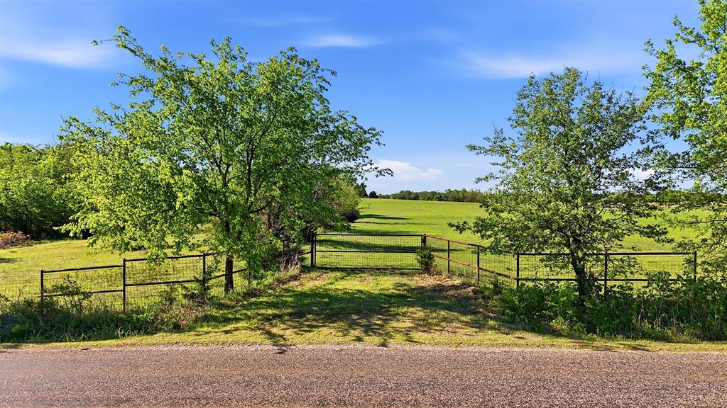 Discover the perfect opportunity to own a beautiful 10.5-acre tract just outside the charming Dexter community, located within highly sought-after Whitesboro ISD. This property offers an ideal combination of open space, scenic views, and natural character—making it the perfect setting for your dream home or private country retreat. An established entrance with a gated access point provides both convenience and security, allowing for easy entry while maintaining privacy. The land features a gently elevated homesite, offering expansive countryside views and the perfect backdrop for a custom build. Scattered mature trees enhance the landscape, providing shade, privacy, and a peaceful, natural setting. With electricity readily available and water access through Northwest Water District, the groundwork is already in place to bring your vision to life. Additionally, fencing along two sides of the property offers a head start for those looking to accommodate livestock, create a homestead, or simply define boundaries. Whether you’re seeking a quiet rural escape, a picturesque homesite, or a long-term investment in a growing area, this property delivers the space, flexibility, and location to suit a variety of needs. Enjoy the tranquility of country living while still being within reach of nearby amenities. Gate is locked—please schedule an appointment for access.