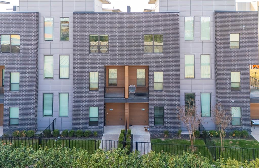 Located in the heart of The Cedars neighborhood, this sophisticated row-style condo features an amazing roof top terrance, with 2 car private garage and fully fenced yard, and blends the perfect combination of modern design, luxury finishes, and an unbeatable urban location. Thoughtfully positioned on the back side of the residences, this home offers enhanced privacy and security while keeping you effortlessly connected to downtown Dallas. The kitchen anchors the home with sleek quartz countertops against dark modern cabinets, designer hardware, high-end Samsung appliance package with refrigerator that stays, wine fridge and center island with waterfall edge that creates a seamless flow to the second-floor balcony. The open concept main living area features modern tile fireplace with electric insert ideal for relaxing or entertaining and wall of windows that provide ample natural lighting. The 3rd level features the oversized master retreat with walk in shower, large closet, feature design wall and custom lighting. A 2nd bedroom with private bath can work as a home office! One of the true highlights is your private rooftop terrace, offering partial downtown skyline views—an ideal setting for morning coffee, sunset cocktails, or hosting friends.  Wide staircases, generous walk-in closets, and a built-in central vacuum system add luxury convenience. This home is fully equipped for modern living with smart Nest thermostats, smart appliances, a smart garage door, Ring doorbell, and an integrated security system. An attached two-car garage with direct access and the gated front yard add another layer of privacy and comfort. Located just minutes from Deep Ellum, The Arts District, and Dallas’ top dining and entertainment destinations. The Dallas Farmers Market is less than half a mile away, making weekend outings easy and walkable. With its rare combination of urban energy, thoughtful upgrades, and residential comfort, this home delivers the best of modern Dallas living.