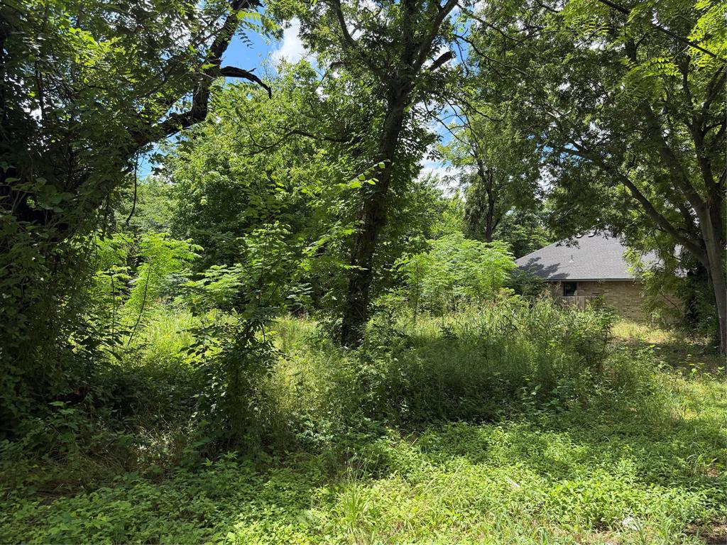 Discover the perfect opportunity to build your custom home on this beautiful 0.23-acre residential lot in the heart of Waxahachie. Featuring mature shade trees and a spacious homesite, this property offers the perfect combination of natural beauty, privacy, and convenience. Situated in an established neighborhood near shopping, dining, schools, and major thoroughfares, this lot is well suited for a custom residence, future investment, or builder opportunity. Enjoy the flexibility to create the home you’ve always envisioned while investing in one of Ellis County’s most desirable and rapidly growing communities. Utilities available nearby. Buyer to verify availability and connection requirements. This is an outstanding opportunity to secure a residential homesite in a thriving location.