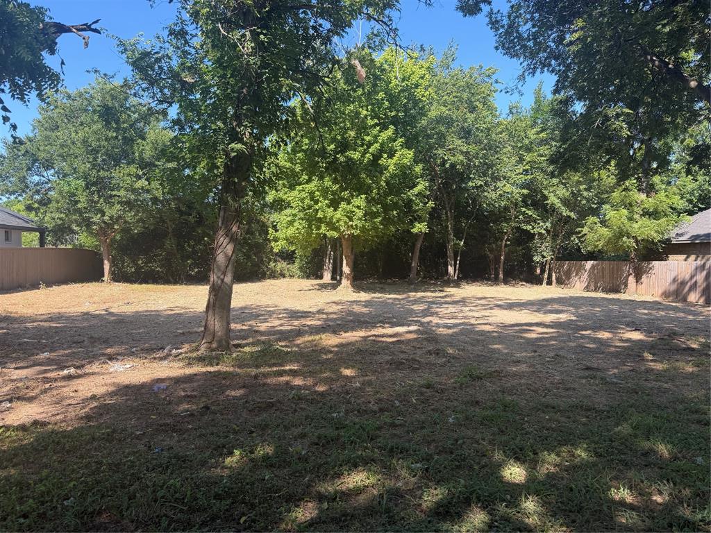 Discover the perfect opportunity to build your custom home on this beautiful 0.23-acre residential lot in the heart of Waxahachie. Featuring mature shade trees and a spacious homesite, this property offers the perfect combination of natural beauty, privacy, and convenience. Situated in an established neighborhood near shopping, dining, schools, and major thoroughfares, this lot is well suited for a custom residence, future investment, or builder opportunity. Enjoy the flexibility to create the home you’ve always envisioned while investing in one of Ellis County’s most desirable and rapidly growing communities. Utilities available nearby. Buyer to verify availability and connection requirements. This is an outstanding opportunity to secure a residential homesite in a thriving location.