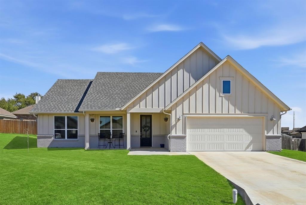 Charming modern farmhouse style home is situated less than 5 miles from Granbury's historic town square. Don't miss this well laid out 3 bedroom floorplan.  The coffered ceiling in the living room lends a touch of elegance, while the well appointed kitchen is the perfect hub for family meals and entertaining.  It is complete with a generous island and lots of cabinet space.  The large primary suite boasts a charming barn door to its ensuite bath outfitted with dual sinks and a large shower.  Two bedrooms and a full bath on the opposite side allow for privacy.  The mud room is conveniently located off the garage and utility room.  A large backyard and a covered front porch are perfect for enjoying the spring breezes. Desirable area of Granbury on city water and an easy commute into Fort Worth.  Meander Estates is a peaceful, family-friendly neighborhood in Granbury, TX. Known for its spacious homes, well-kept lawns, and a community lake, it's a great place for those who enjoy outdoor activities and a quiet, suburban lifestyle.
