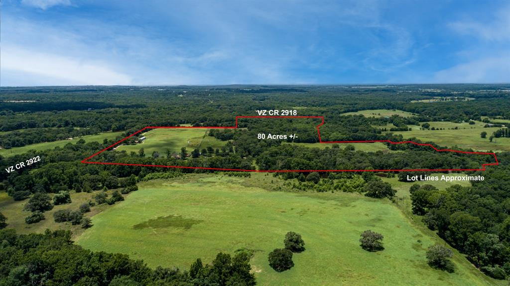 80.79± acres of prime East Texas land offering the perfect blend of beauty, functionality, and privacy. This versatile property features a mix of open, hay-producing pasture and mature wooded areas—ideal for grazing, hunting, recreation, or simply enjoying the outdoors.

The 2–3 bedroom, 1.5-bath brick home is well-positioned to capture scenic views in every direction. Large windows fill the home with natural light and provide a front-row seat to rolling pasture, multiple ponds, and abundant wildlife, including frequent deer sightings. With solid construction and a great layout, the home is ready for your personal updates to make it your own.

The land is the true highlight—multiple ponds provide water for livestock, fishing opportunities, and attract a wide variety of wildlife, enhancing both the beauty and recreational appeal of the property. Several barns and outbuildings offer ample space for equipment, storage, or agricultural use, making this a functional property for both work and play.

Tucked away in a peaceful, private setting, this property offers the quiet lifestyle so many are searching for while still being within a reasonable drive to town. Whether you're looking to run cattle, cut hay, hunt, create a weekend retreat, or build your dream ranch, this property is full of potential.

A rare opportunity to own a large, multi-use tract with water, improvements, and room to grow.
