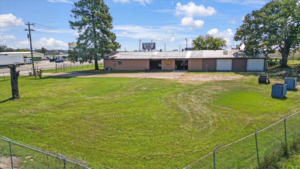 Exciting Commercial Real Estate Opportunity! 

Prime 1.2 acre commercial property featuring a fully operational vehicle repair shop that has been a community staple for over 30 years is now for sale! Located on the bustling Highway 69 N, this site is just five minutes from the Interstate 20 Lindale exit, ensuring maximum visibility and accessibility. 

Key Features:   
- Prime Location: Situated next to Camping World and Rush Truck Center 
- Just a stone's throw away (5 minutes) from Interstate 20 and major restaurants and shopping  
- High Traffic Exposure: Perfect for attracting customers and investors in a thriving area.  

This property presents a unique opportunity for buyers looking to dive into a lucrative investment or expand their commercial portfolio in a high-demand market. Bring your vision to life, the potential is limitless! 

Don’t miss out on this chance to own a piece of prime commercial real estate!