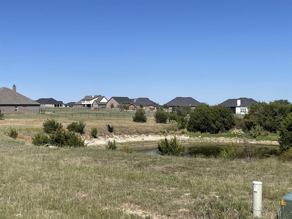Beautiful 2.071 acre lot with a pond and nice views.  Pond is on the side of the property so there is plenty of space to build your dream home.  This is one of the few good buildable lots left and available in Rolling Creek Ranch.