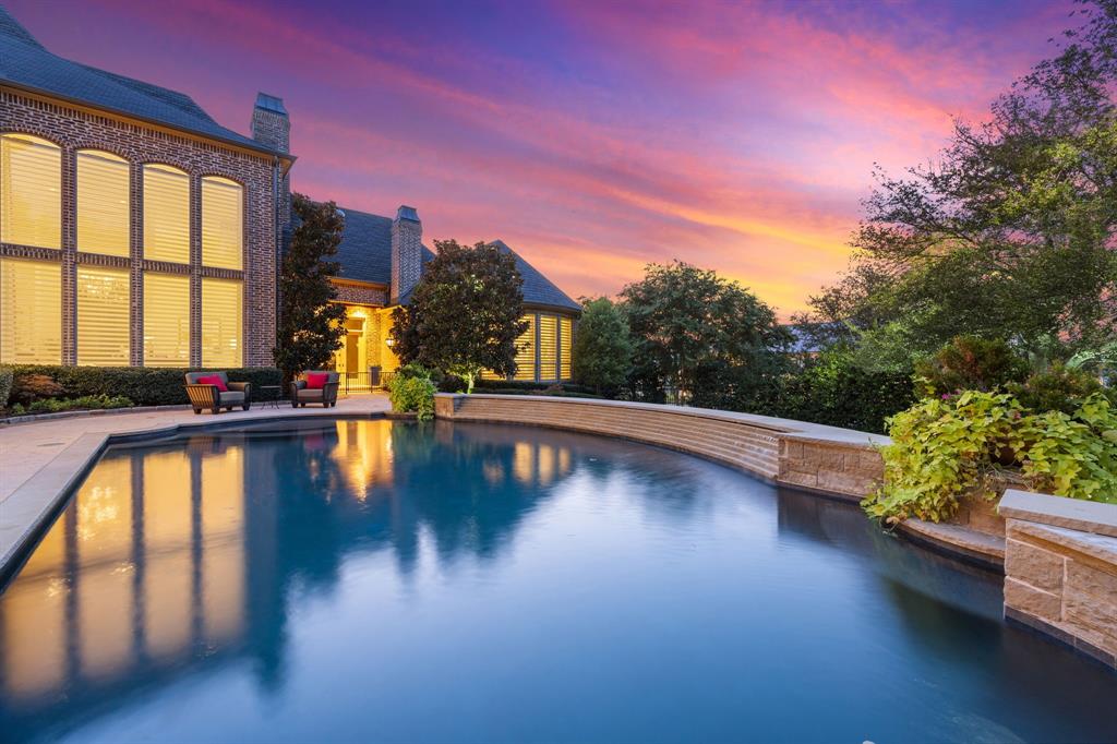 Nestled in an exclusive gated enclave, this extraordinary estate embodies elegance, sophistication, and refined living. Spanning over 8,600 square feet, the home masterfully blends visionary design with exceptional architecture. Boasting 5 spacious bedrooms and 7 luxurious baths, the layout is thoughtfully designed for both grand entertaining and intimate living. The first floor features a state-of-the-art theater room and an expansive wet bar that seamlessly connects to a custom wine cellar—ideal for hosting unforgettable gatherings. The gourmet kitchen is a chef’s dream, showcasing exotic granite countertops, bespoke cabinetry, and top-of-the-line Miele appliances. Upstairs, an oversized game room with a secondary wet bar offers the perfect setting for recreation and relaxation. Outside, lush, manicured landscaping ensures total privacy while creating a serene backdrop for the heated pool and spa—a true resort-style escape. Every inch of this estate has been meticulously updated, including designer lighting, a curated color palette, rich hardwood flooring, custom shades, and striking marble fireplaces. The primary suite is a sanctuary unto itself, with a completely remodeled spa-inspired bathroom and a boutique-style walk-in closet. This home is the ultimate expression of luxury living—flawlessly finished and ready to impress. The furnishings and artwork throughout the home are the epitome of elegant living, curated to complement the home's sophisticated ambiance. If you're seeking a property as unique and individual as you are, look no further—this is the one.  
The Golf Club at Twin Creeks is home to an award-winning Arnold Palmer Signature Golf Course that offers a premier golfing experience for players of all skill levels. Surrounded by Twin Creeks a premier golf courses in Texas, which provides an exceptional blend of challenging play, world-class amenities, and outstanding service. Easy access to Legacy West, Stonebriar Country Club, The Star at Frisco.