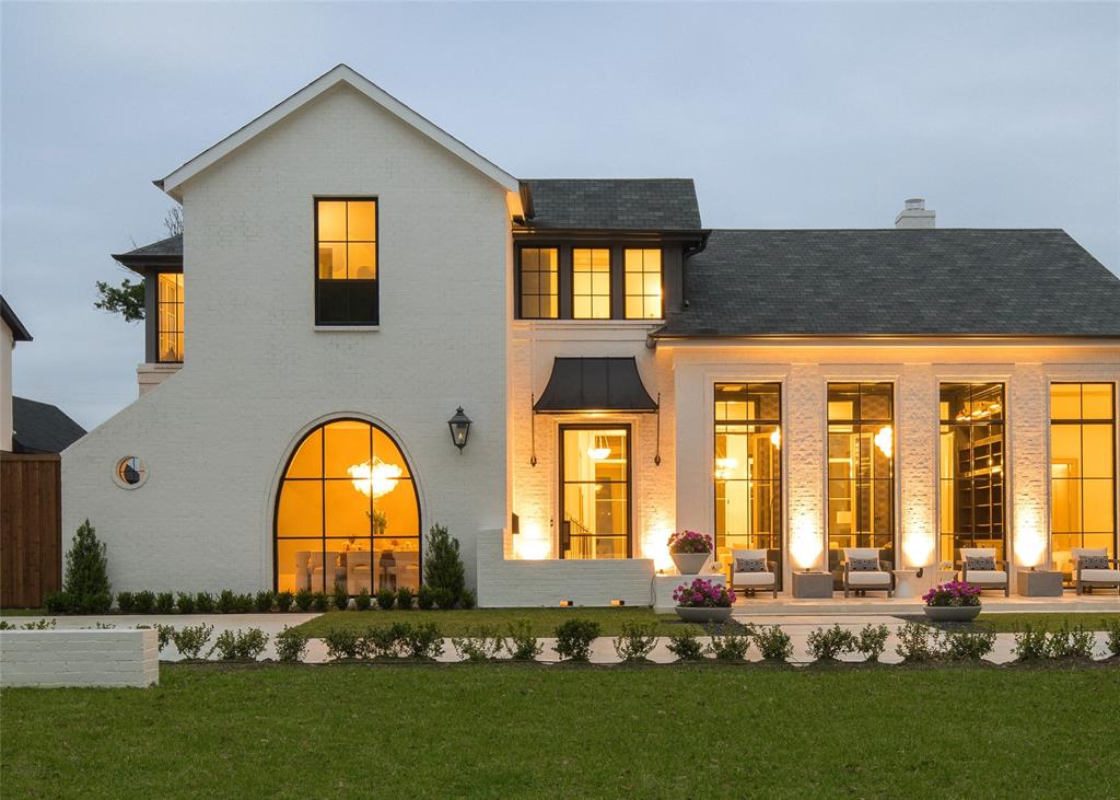 Introducing a truly exquisite residence that epitomizes luxury living. Custom built by Heritage Blue Homes, on 100x165 lot in Preston Hollow, this thoughtfully designed floor plan features 5 beds (DS Primary & Guest) 5.3 baths, each meticulously designed to offer an unparalleled level of comfort & sophistication. Stunning interior is flooded w light thanks to high ceilings, oversized windows & doors that seamlessly connect the indoor-outdoor spaces. Open living room leads to the kitchen, featuring large marble island, premiere appliances, paired w high gloss lacquered cabinetry. The ds primary suite provides a serene retreat overlooking pool & boasts a spa-like marble bathroom w 2 oversized separate closets. Upstairs has wide hallways, 3 bedroom suites, & large playroom. Outside enjoy the meticulously landscaped grounds, 2 covered terraces, retractable screens, fireplace, ceiling heaters, plus a Wolf built in grill & stunning pool-spa. 3-car garage + whole house generator.