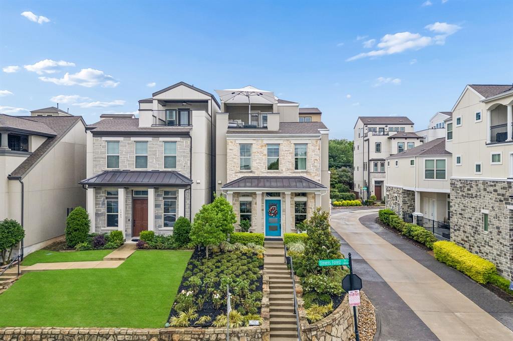 Experience elevated urban living at 1925 Woodland Heights Place, a professionally designed three-story single-family residence offering panoramic downtown Dallas skyline views, refined interior upgrades, and exceptional access to major commuter routes including I-30. Built in 2017 and on a desirable corner lot at one of the highest points of the street, this contemporary zero-lot-line home combines sophisticated style with low-maintenance convenience near Stevens Park Golf Course. Spanning ~2,714 sq ft, the floor plan includes 3 spacious bedrooms, 2 full, and 2 half baths. High-end interior highlights include wide-plank hardwood floors, impressive 11-ft ceilings, in-ceiling speakers, automated shades, Lutron dimmers, Foscarini lighting, and designer wallpapers (Cole & Son, Thibaut, and Zoffany) and fabrics (Kravet) for a polished atmosphere. The chef’s kitchen showcases ceiling-height cabinetry, soft-close drawers, abundant storage, and an open layout flowing into the living and dining areas. Spa-inspired bathrooms feature ceiling-height tilework in showers for a luxurious aesthetic. Outdoor living includes two private decks with gas lines, highlighted by an expansive third-floor rooftop deck, sky lounge, and adjacent city room perfect for taking in breathtaking skyline sunsets everyday. Professionally designed landscaping enhances curb appeal and a built-in pest control system with an exterior port allows for contactless service. Tech & security: builder-installed security system, Schlage electronic deadbolt, Arlo video doorbell, wireless security cameras, and a 40A EV charging circuit. Community amenities include 2 gated dog parks for residents only. Offering a rare combination of skyline views, contemporary architecture, premium finishes, and lock-and-leave convenience, this designer-updated residence sits in one of Dallas’ most connected urban settings close to premier dining, shopping, and major employment centers, making commuting throughout Dallas efficient.