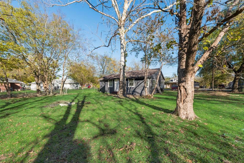 Investor Special! Open Floor Plan with partial updates throughout including paint inside and outside, updated light fixtures, renovated front porch, vinyl flooring, Primary bedroom has a custom walk in closet. Enormous backyard that can host large gatherings.