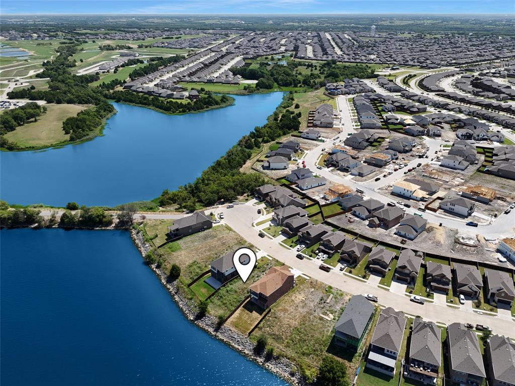 THE BEST LOT IN THE COMMUNITY SITUATED LAKEFRONT ON LAKE RAY HUBBARD! Backyard faces West so you will have daily Sunset Views over the Lake, distant views of the Dallas Skyline, and you can open your back gate and hop on a paddle board or kayak within seconds and be in the water. This is one of a handful of lots that were sold before Travis Ranch was developed so this allows you to build ANY house you want here. Have a dream home? You can build it! Need pre-drafted plans? We can get those for you! With no required deadline for construction, you can build now or wait as long as you wish but the lot is ready to be built on with utilities to the property already. Surrounded by million dollar homes, you also have the enjoyment of the cul-de-sac, grassy park, fishing area, and no thru-traffic. Another great thing is these lots were recently annexed into the HOA, which gives you access to all of the amenities, Playgrounds, Pools, etc for all of Travis Ranch. Self Touring is available anytime