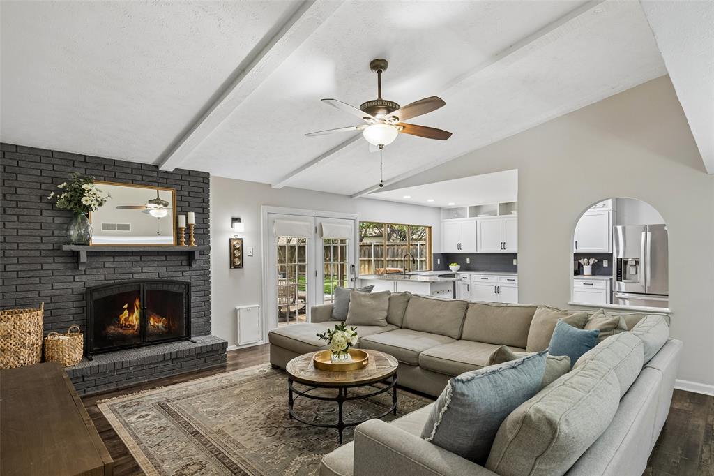 Thoughtfully renovated home sits in the heart of the sought-after Highland Meadows neighborhood, served by highly rated Richardson ISD schools. Situated on a large, beautifully maintained corner lot, the one level home provides an inviting open-concept layout. The interior features two distinct living spaces, hardwood flooring throughout, & a neutral color palette that enhances the light-filled home. The remodeled chef's kitchen serves as the true heart of the home, opening seamlessly to the main living & dining areas and includes modern granite countertops, white custom cabinetry, stainless steel appliances, and abundant storage. A unique feature is the large sliding window that opens to the patio, allowing you to bring the outdoors in & stay connected to the action outside with a convenient serving bar. An adjacent butler's pantry provides essential extra storage and serving space, leading gracefully into the large formal dining room. A spacious den features vaulted ceilings and a large brick fireplace while elegant French doors offer expansive views of the outdoor area & provide direct access to the patio. The primary suite serves as a private, calming refuge at the end of the day, complete with an ensuite bath featuring a large glass-enclosed shower & designer finishes. Step outside to the extraordinary outdoor living area, featuring a large covered stone patio designed for year-round enjoyment. With mature landscaping & plenty of room to roam, the backyard creates the perfect setting for outdoor dining, weekend gatherings, or quiet, relaxing evenings. Updated features include PVC plumbing, new HVAC 2025, new kitchen cabinetry, and more. This property blends character and livable design with standout outdoor amenities, making it a rare opportunity in one of Dallas' most coveted location just minutes from White Rock Lake, premier shopping & dining & access to major highways.