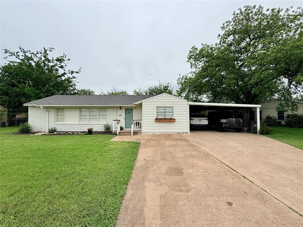 PRICE REDUCED PLUS OFFERING A GREAT BONUS INCENTIVE to BUYERS!! Sellers are offering $5,000 in concessions to the Buyer! These funds can be used toward your closing costs, interest rate buy down, loan fees or prepaid expenses making it much more affordable to purchase this home! Very charming 4 bedroom, 2 bathroom, 2 car carport home with recent updates including Laminate flooring that looks like wood throughout, fresh interior and exterior paint, and a new oversized concrete patio and walkway to the workshop! Two spacious and inviting living areas offer exceptional versatility and functionality with separate front door access; Beautiful kitchen offering Granite countertops, tumbled marble backsplash, double under-mount stainless steel sink, built-in dishwasher, electric range, lighted vent-a-hood, refrigerator and microwave.  Dishwasher and electric range are NEW.  BRAND NEW water heater in May, 2025! Primary bedroom has two closets and a large ensuite Jack & Jill bath with an oversized vanity with sink, step-in shower and toilet which also services another bedroom.  Hall bathroom offers a tub-shower combo, vanity with sink and toilet.  Laundry room has full-size washer & dryer connections, space for a freezer and a shelf for supplies or decor.  The attached double carport offers lots of additional enclosed storage space. Large chain-link fenced perimeter backyard with alley access.  25' x 17' WORKSHOP on concrete slab with walk-in access door, roll-up door, 110 and 220 volt outlets and LED overhead lighting;  Great floor plan, exceptional amenities and tons of additional storage space that will make your busy life a breeze!  Perfect for a growing family or a turn-key rental investment!