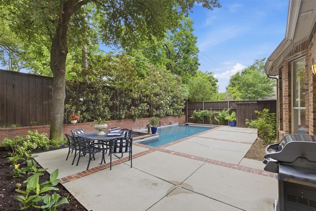 Tucked inside the gated Estates at Forest Hills community, this beautiful and fully remodeled East Dallas home blends comfort, style, and everyday livability in all the right ways. Gorgeous wood floors run throughout the first floor, while the inviting living room with a wood-burning fireplace creates the perfect cozy gathering space. The updated kitchen is equally stunning with contrasting stone countertops, gas cooking, abundant storage, and designer finishes that make the entire home feel elevated yet approachable. Upstairs, a second living area gives everyone room to spread out, whether for movie nights, a playroom, or the perfect media lounge. The spacious primary suite feels like a true retreat with a relaxing garden tub, beautiful marble tile work, dual sink vanity, and two closets designed for real life. You’ll also find two secondary bedrooms and an additional full bathroom, creating a functional layout with space for everyone. Downstairs, the flexible fourth bedroom can easily become your home office, guest room, or workout space depending on your lifestyle needs. But the real magic happens outside. The private New Orleans courtyard-inspired backyard feels like your own hidden getaway with an app-controlled heated pool and spa, gas grill connection, and an 8-foot privacy fence that makes entertaining or relaxing feel effortless. With a location just minutes from White Rock Lake, the Dallas Arboretum, Casa Linda dining and shopping, downtown Dallas, and easy access to I-30, this home truly gives you the best of East Dallas living. This is the kind of home people wait for.