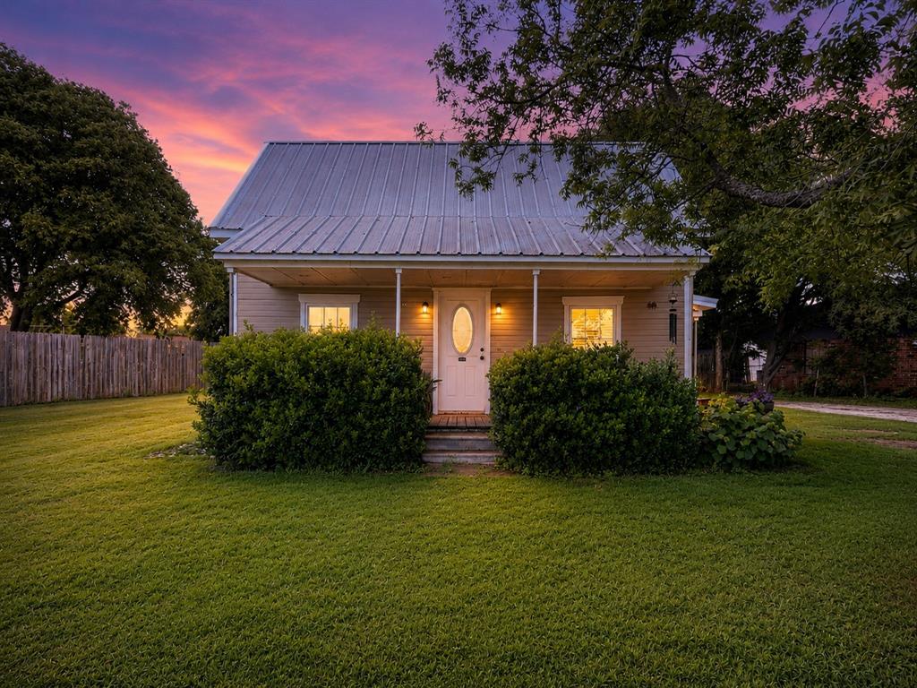 Charming Texas character meets modern comfort in this beautifully updated 1940 home located in the heart of the small town of Rio Vista. Offering 1,234 square feet, this 2 bedroom, 2 bath home features a spacious layout with timeless charm and thoughtful updates throughout.

The bright, open kitchen showcases granite countertops, a farmhouse sink perfectly placed beneath the window, and all stainless steel appliances. The open living and dining spaces create an inviting atmosphere while maintaining the warm character expected in a historic Texas home.

The oversized primary suite features vaulted ceilings and a large ensuite bath complete with a jetted tub, granite countertops, and stylish vessel sinks. Utility room is conveniently located just off the primary bath.

Improvements include updated fixtures, vinyl plank flooring in the main living areas, and carpet in the bedrooms. A durable metal roof and Trane HVAC unit add long-term value and peace of mind.

Outside, enjoy mature trees, a welcoming covered front porch, and the charm of small-town living while still being conveniently located for an easy commute. This home offers the perfect blend of Texas history, character, and modern updates in the peaceful community of Rio Vista.