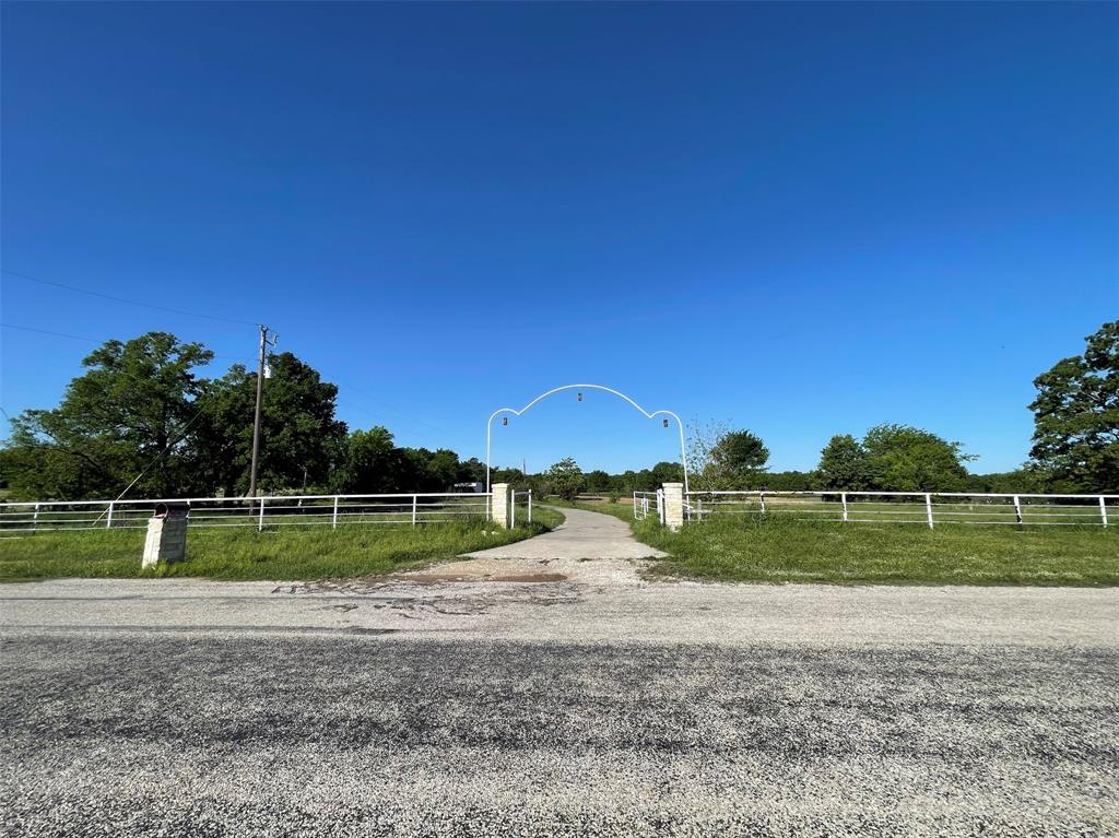 This lakefront property offers several options to build!  You can build a large custom home on the 7.45-acre parent tract or subdivide it into two tracts with 3 acres minimum and build two home sites.  The property backs up to a 12-acre lake with a dock, has electricity to the site and is supplied by Bright Star water.  The front of the property features 300 feet of road frontage, a pipe fence and a gated entry with a recently added concrete driveway that leads to a potential home site. If you want a smaller portion of this tract, refer to MLS #20607931 for a 3-acre tract and MLS #20607935 for a 4.4-acre tract.  Enjoy peaceful, country living on this homesite within minutes of Emory and Lake Fork.