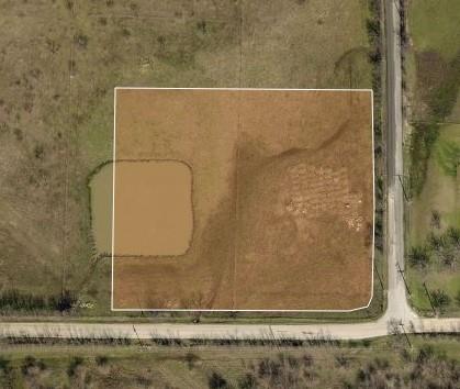 Great Location - Close to Texas Motor Speedway. This small tract sits on a convenient corner just outside of Justin and only a couple of blocks to Hwy 156 and Hwy 114. Ideal for small shop or Mechanics garage, small business location!