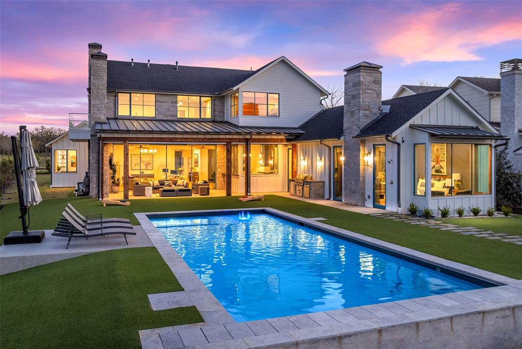 Just over an hour from Dallas, this newly constructed, Jason Luther Architects designed home in the coveted Long Cove community offers a refined, modern expression of luxury lake living. This striking 5 bedroom, 6,780 SF residence is filled with natural light and framed by sweeping views of Cedar Creek Lake. A stunning open-plan chef’s kitchen flows into the great room, complemented by a dedicated wine room and bar that open seamlessly onto the screened terrace—perfect for effortless indoor–outdoor entertaining.
The pool, spa, fire pit, basketball hoop, and pickleball court create a private resort-style setting on this spacious property, offering endless recreation and relaxation against the serene lake backdrop.
The luxurious primary suite features an open fireplace and expansive lake views, with an additional guest suite conveniently located on the main level. A formal dining room, private office, and fully equipped gym complete the first floor.
Above the garage, a separate guest suite—accessed by its own staircase—includes a TV room, kitchenette, bedroom, and full bath, providing ideal accommodations for extended stays. Upstairs in the main home, two bunk rooms and a generous game room with lake views offer the perfect retreat for family and guests.
Located perfectly on the open water within Long Cove’s 1,200-acre community, owners enjoy access to two community pools, a woodland adventure park, pickleball, tennis, and basketball courts, a 9-hole golf course, driving range, endless wooded trails, a bike hut, stocked fishing ponds, beach volleyball and bocce ball along full access to concierge style amenities—boat valet, docks, curated events, and seasonal experiences—making second home living simple, elevated, and endlessly enjoyable. Weekends here transform into something truly magical.