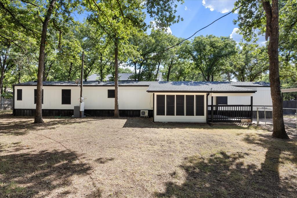 Charming Lake Access Home Near Lake Granbury! Enjoy the best of lake style living in this spacious 3 bedroom, 2 bathroom singlewide home on over a third of an acre. Built in 1999 and featuring 1,536 square feet of living space, this move in ready property boasts modern luxury vinyl plank flooring, an open floor plan, a great eat-in kitchen, and accessible features. Lake Granbury Perks Located in Bluewater Shores with full community access to a private boat ramp, dock, fishing spots, and clubhouse for just $130 year. The refrigerator, washer, and dryer are all included with the property. Stunning Yard & Storage. Relax outdoors under beautiful mature shade trees and a fully shaded backyard patio. The property also features two very nice custom storage sheds equipped with full electricity and lighting. Endless Parking includes 2 covered carports with plenty of room for your boat, truck, or RV. Located in a unincorporated area in the highly rated Granbury ISD and Acton schools with quick access to Hwy 377. Flexible purchasing options make it easy to buy all types are welcome, including FHA, VA, USDA, Conventional, and Cash.