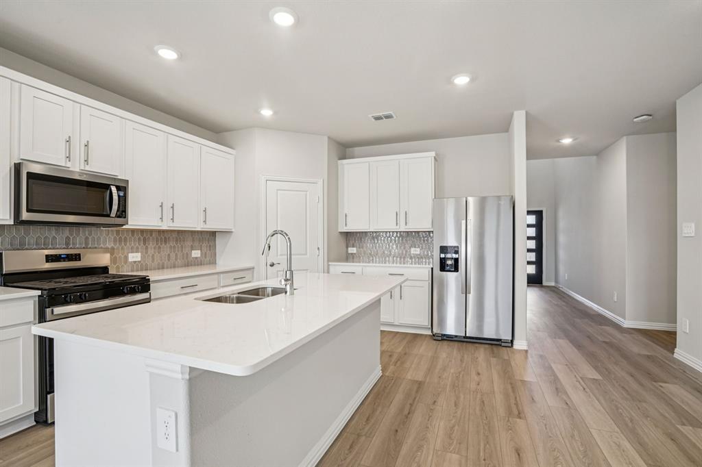 BRAND NEW energy - efficient home Sep 2026! Skip the theater and enjoy movie night at home from the comfort of the Kessler's second-story game room. White cabinets with veined white quartz countertops, muted beige EVP flooring with light taupe carpet. New energy-efficient move-in ready homes in Dallas-Fort Worth include a washer, dryer, fridge, and whole home blinds, plus they can be closing-ready in 60 days or less–guaranteed. Have it all: Relax in your private primary suite, enjoy the covered back patio, and our open concept floorplans, all with easy access to Fort Worth, Arlington, and Grapevine.
