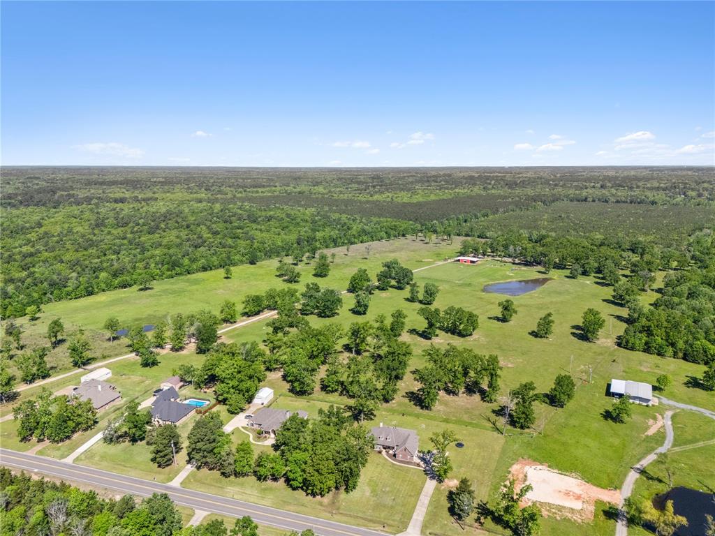 This 9+ acre subdivision concept has been engineered and approved. This development property represents the second offering in Heathwood Estates. Positioned at the front of the larger tract, this 7-lot residential development may be purchased separately from the 65+ acre farm. The plan is conceptual and can be changed to accommodate the buyer or left as is. A gated entry, manicured landscaping, and scenic views create an inviting setting throughout the property.

Conveniently located less than 20 minutes from Downtown Shreveport, the subdivision combines the benefits of quiet rural living with excellent access to major thoroughfares. Interstates 49 and 220 are within a 10-minute drive, while Interstate 20 and LA 3132 are also nearby, making commutes and connections simple. Despite its accessibility, the area offers a peaceful and private environment—well-suited for those seeking space, investment opportunities, or a working farm close to city conveniences.

The 9-acre tract is a stand-alone offering, but it may also be combined with approximately 56 additional acres that include a ranch-style home, barn, ponds, and other improvements. The 56 acres are listed separately at $1,400,000. The entire 65+ acre estate (including this listing) is available as a combined package for $1,790,000. For full sale details, please refer to the companion 65 acre listing.
