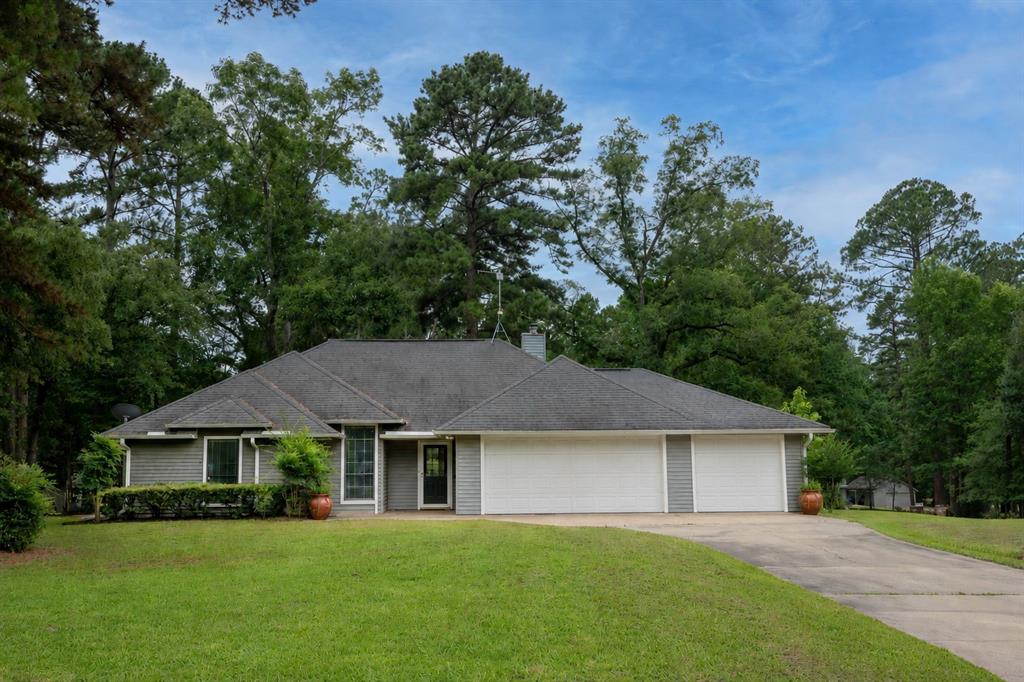 Holly Lake Ranch is a peaceful gated golf course community located in the heart of East Texas Pineywoods.  Welcome to 108 Old Barn Circle, situated on one of the nicest streets in the community, lined with trees, and beautifully well maintained yards. This home features 3 bedrooms, 2 bathrooms  a large living room, a true dining room, and an updated kitchen.  As you enter the home you’re greeted with natural light and views to the backyard. The living room is positioned around a fireplace and custom built-ins, a perfect place to unwind. The updated kitchen offers granite countertops, lots of cabinet space, stainless steel refrigerator that stays, microwave, dishwasher, and cooktop with two ovens. The primary suite is located at the back of the home and offers a large bathroom with a soaking tub and seperate shower, dual vanities and two closets. The 2 guest rooms are positioned around the guest bathroom, and have nice views of the front and side yards. The backyard features a newly refinished deck, perfect to relax on. Other perks we love about this home, the 2 car garage has direct access to the golf cart garage, close proximity to the front entrance, the concierge security service is a huge bonus and is available 24 hrs a day to help and all the neighbors are great. Holly Lake is located within 20 minutes to Mineola where you can catch am Amtrak train directly to Dallas and Fort Worth. This is truly a special community!