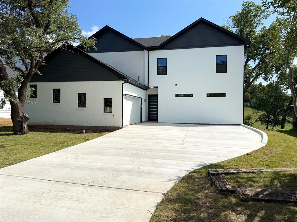 STUNNING new CUSTOM HOME with HIGH-END FINISHES and beautiful view of WALKING TRAIL behind the house, Located in a charming, ESTABLISHED neighborhood! NATURAL LIGHT delight home! This beautifully designed 5-BEDROOM, 3.5-BATHROOM home offers a SPACIOUS OPEN LAYOUT with high-end finishes throughout, including a LUXURIOUS PRIMARY SUITE on the first floor with an EN-SUITE BATHROOM and an OPEN FLOOR PLAN ideal for both family living and ENTERTAINING. The GOURMET KITCHEN features upgraded CUSTOM CABINETRY, a HUGE CENTRAL ISLAND, and gorgeous QUARTZ COUNTERTOPS. Elegant interior details include HIGH CEILINGS — 11 ft on the first floor and 10 ft on the second floor — RECESSED LIGHTING, and stylish flooring. The spacious PRIMARY BEDROOM offers a SERENE RETREAT with ample space, while the 2-CAR GARAGE provides convenient access and extra storage. Centrally located with QUICK ACCESS to major roadways — Loop 820, I-30, and State Highway 121 — shopping, dining, and more. This home combines MODERN COMFORT and EXCEPTIONAL CRAFTSMANSHIP in a well-established community. Make this home yours!