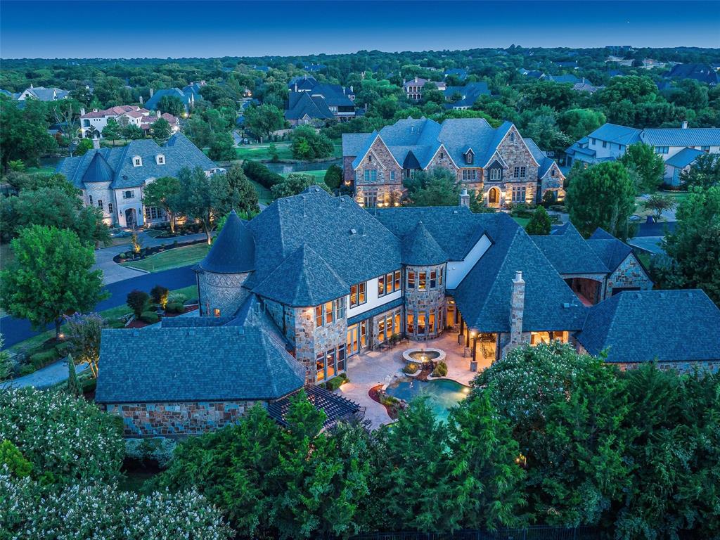 Welcome home to this Gorgeous Simmons Custom Homes Westlake Estate in coveted & gated Glenwyck Farms! Finishes are at their finest upon entering w soaring ceilings, marble & wood floors, floating circular staircase, impressive Executive study w fireplace and amazing views throughout. The Primary suite is private, spacious and well adorned.  As you move into the Family areas you find a gorgeous Chef's Kitchen with large island, pro appliances, dual dishwashers & warming ovens, ice maker, wine fridge, display cabinets, large Pantry & Butlery. The Breakfast room enjoys glorious Pool and backyard views. The Family room is ready for large crowd with glowing fireplace & massive solid wood beams. Media room is adjacent the family for easy access. Private Guest suite down, 3 oversized Bedrooms up with built ins & en-suite baths, plus a large Game room + Craft room. Step outside to a garden oasis with sparkling Claffey pool, waterfalls, lush landscaping, outdoor kitchen & living + mature trees.