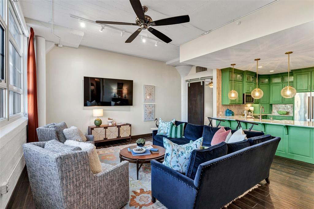 Own a piece of Fort Worth history without sacrificing an ounce of personality. Located within the 1928 Art Deco landmark of Montgomery Plaza, this one-of-a-kind residence has been transformed by acclaimed local designer Shauna Glenn into a high-design sanctuary for the bold. The interior masterfully balances industrial-strength concrete architecture with whimsical finishes and statement lighting, creating a space that feels both curated and comfortable. The kitchen’s custom electric-green cabinetry serves as a vibrant focal point for urban hosting, while oversized windows offer a front-row seat to the downtown skyline, ensuring your dinner parties have the ultimate backdrop.

Designed for the effortless lock-and-leave lifestyle, this home caters to those who want the pulse of the city with very little maintenance. When it is time to unwind, retreat to your primary suite where deep teal ceilings and a fully remodeled spa-like bathroom, complete with a freestanding soaking tub, offer a boutique hotel experience every night. The transition from the city to your sanctuary is seamless; located just steps from the elevator, the unit offers unparalleled convenience alongside two prime secured parking spots and the security of a 24-hour concierge.

Beyond your front door, the amenities are unmatched. From the legendary one-acre rooftop pool deck and private cabanas to the world-class museums of the Cultural District just minutes away, this is the pinnacle of curated Fort Worth living. Whether you are hosting an intimate gathering in your designer kitchen or jetting off for the weekend, this residence offers the security, style, and central location that define the modern urban experience.