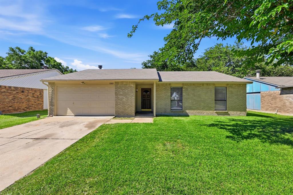 Adorable and AVAILABLE NOW! Welcome to 7323 Ashcrest - a well maintained 3 bedroom, 2 bath home conveniently located with easy access to all DFW has to offer.  HVAC replaced in 2023, new water heater in 2025, updated baths, new ceiling fans in living room and bedroom, luxury vinyl plank in the bedrooms - move in READY! This home features a bright and open layout with a spacious living area that flows seamlessly into the kitchen. The main living space is tiled throughout, offering easy maintenance and a clean look. The kitchen includes white cabinetry, dual sink, BRAND NEW stainless steel dishwasher, and a tile countertop island with a built-in range, perfect for entertaining or casual dining. FRIDGE INCLUDED! Large windows fill the rooms with natural light, creating a bright and welcoming atmosphere. Outside you'll find a spacious backyard with plenty of room to relax, play, or entertain.  The backyard is a blank canvas, ready for you to make it your own.