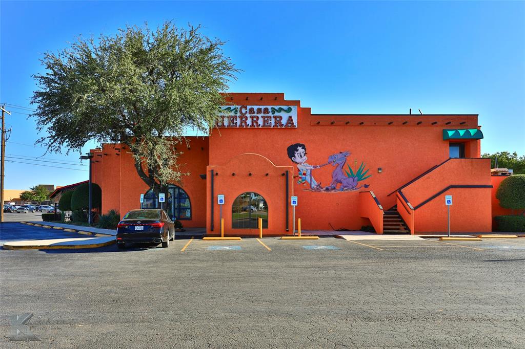 Prime commercial space near Mall of Abilene. Built in 1985, this restaurant property has been home to Casa Herrera Mexican restaurant for over three decades. While the restaurant business is not for sale, this property is and offers a high-visibility, high-traffic location surrounded by national retailers and hotels. 8435 sq feet of interior space is divided into a primary dining room flanked by three additional dining rooms and an outdoor patio.  A second-story party room is available for private parties and has interior and exterior access.  65 parking spaces are available with a 25,821 sf asphalt parking lot and parking for the Mall of Abilene abuts the property on the east and south.