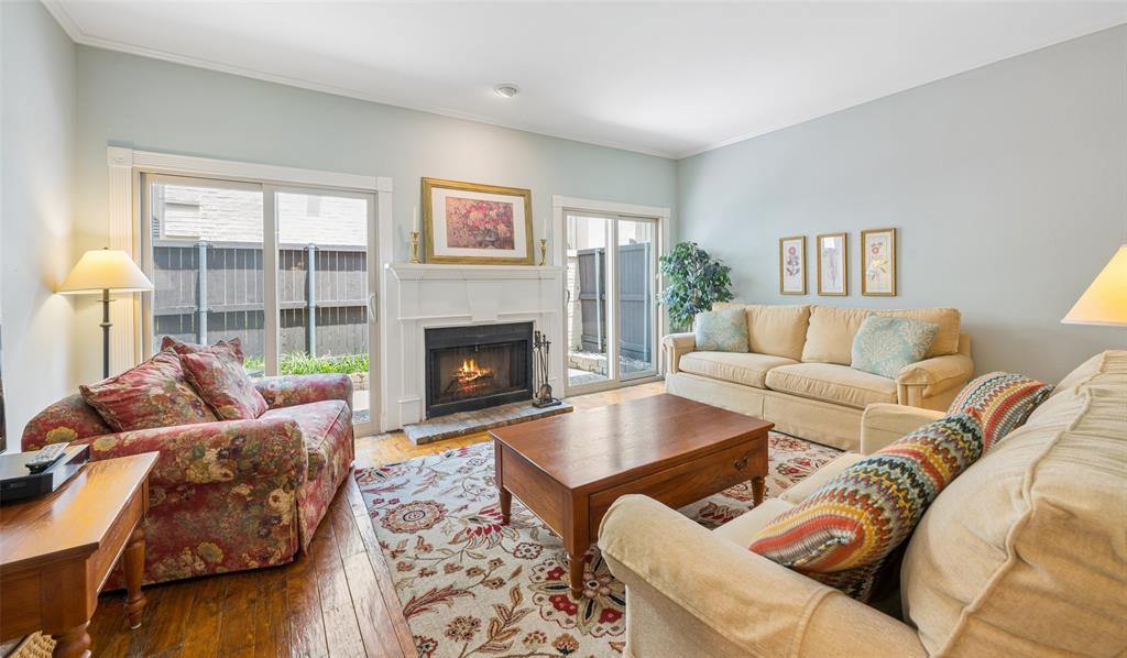 Wonderfully eclectic condo!  This charming condo is located in a quiet complex between the vibrant Uptown and Knox Henderson areas and two blocks from The Katy Trail.  The first floor living area features a wood burning fireplace with sliding doors leading to the patio.  The galley kitchen is complete with stainless appliances and is located between the living area and dining room.  A powder bath completes the first floor.  The second floor offers split bedrooms with ensuite baths and the stacked washer& dryer closet.  There are two assigned parking spaces.  The front parking space is #24.  The back parking space is #25.