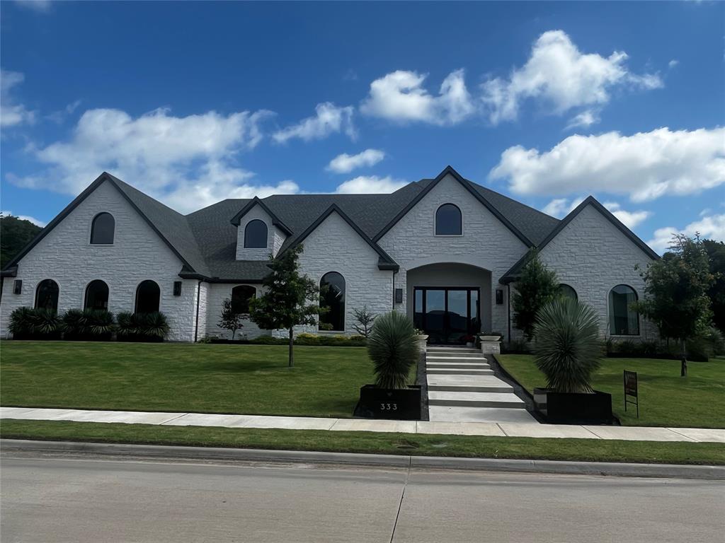 Luxury One-Story Estate in the Heart of Heath. Custom-built, single-story estate ideally located in the heart of Heath, just minutes from shopping, dining, top-rated schools, and beautiful Lake Ray Hubbard. Designed for both everyday comfort and grand entertainment, this remarkable home offers 4 spacious bedrooms & 4 full bathrooms, including 2 private primary suites, each featuring its own dedicated living area for ultimate flexibility and privacy. 14' ceilings at the entryway & 12' ceilings in the main living area. Private study currently a custom bar with ice-maker provides the perfect work-from-home space. At the heart of the home is a chef-inspired gourmet kitchen, showcasing a Viking Sub-Zero refrigerator, Wolf appliances, quartz countertops and backsplash, oversized island, abundant custom cabinetry, walk-in pantry, generous dining area. Entertain guests in style with the elegant bar area and striking glass-enclosed custom bar. Main owner's retreat is a true sanctuary, featuring a spa-like bath with dual vanities, a walk-in shower, soaking tub, fireplace, and an expansive custom walk-in closet. Secondary suite offers a private living area and full bath, making it ideal for guests, multigenerational living, or a mother-in-law suite. Situated on approximately 0.83 acres, the property backs to a beautiful tree-lined boundary, creating a private and serene setting. Resort-style outdoor amenities include a built-in swimming pool, private pickleball court, and exceptional outdoor living spaces designed for relaxation and entertainment. Adding even more potential, approximately 500 square feet of unfinished space above the garage awaits your vision, perfect for a second office, game room, media room, fitness studio, or additional living space. Whether you are hosting unforgettable gatherings or seeking a peaceful retreat with every luxury amenity, this extraordinary property truly offers the best of both worlds. A rare opportunity and an absolute must-see in Heath.