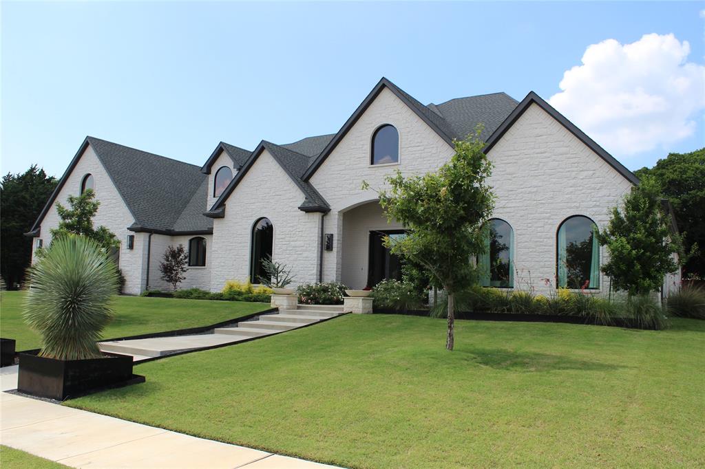 Luxury One-Story Estate in the Heart of Heath. Custom-built, single-story estate ideally located in the heart of Heath, just minutes from shopping, dining, top-rated schools, and beautiful Lake Ray Hubbard. Designed for both everyday comfort and grand entertainment, this remarkable home offers 4 spacious bedrooms and 4 full bathrooms, including two private primary suites, each featuring its own dedicated living area for ultimate flexibility and privacy. A private study currently a custom bar with ice-maker provides the perfect work-from-home space. At the heart of the home is a chef-inspired gourmet kitchen, showcasing a Viking Sub-Zero refrigerator, Wolf appliances, quartz countertops and backsplash, an oversized island, abundant custom cabinetry, a walk-in pantry, and a generous dining area. Entertain guests in style with the elegant bar area and striking glass-enclosed custom bar. The main owner's retreat is a true sanctuary, featuring a spa-like bath with dual vanities, a walk-in shower, soaking tub, fireplace, and an expansive custom walk-in closet. The secondary suite offers a private living area and full bath, making it ideal for guests, multigenerational living, or a mother-in-law suite. Situated on approximately 0.83 acres, the property backs to a beautiful tree-lined boundary, creating a private and serene setting. Resort-style outdoor amenities include a built-in swimming pool, private pickleball court, and exceptional outdoor living spaces designed for relaxation and entertainment. Adding even more potential, approximately 500 square feet of unfinished space above the garage awaits your vision, perfect for a second office, game room, media room, fitness studio, or additional living space. Whether you are hosting unforgettable gatherings or seeking a peaceful retreat with every luxury amenity, this extraordinary property truly offers the best of both worlds. A rare opportunity and an absolute must-see in Heath.